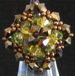 Swarovski krystall snurretopp 4mm DORADO 2X per 12